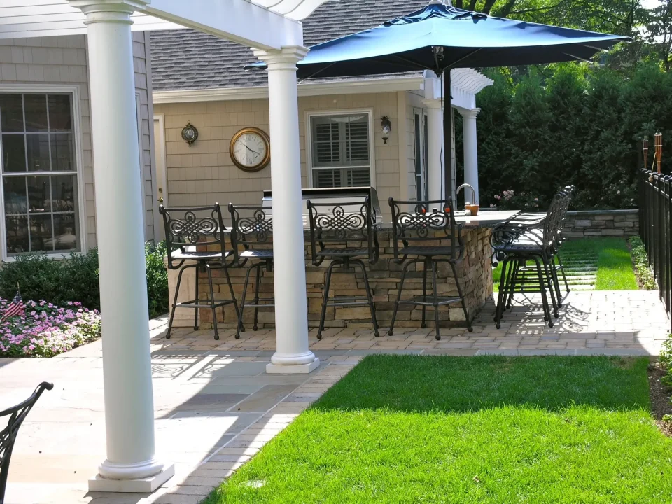 Patio with furniture, umbrella, and clock
