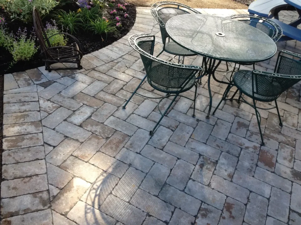backyard pavers with wrought iron patio furniture