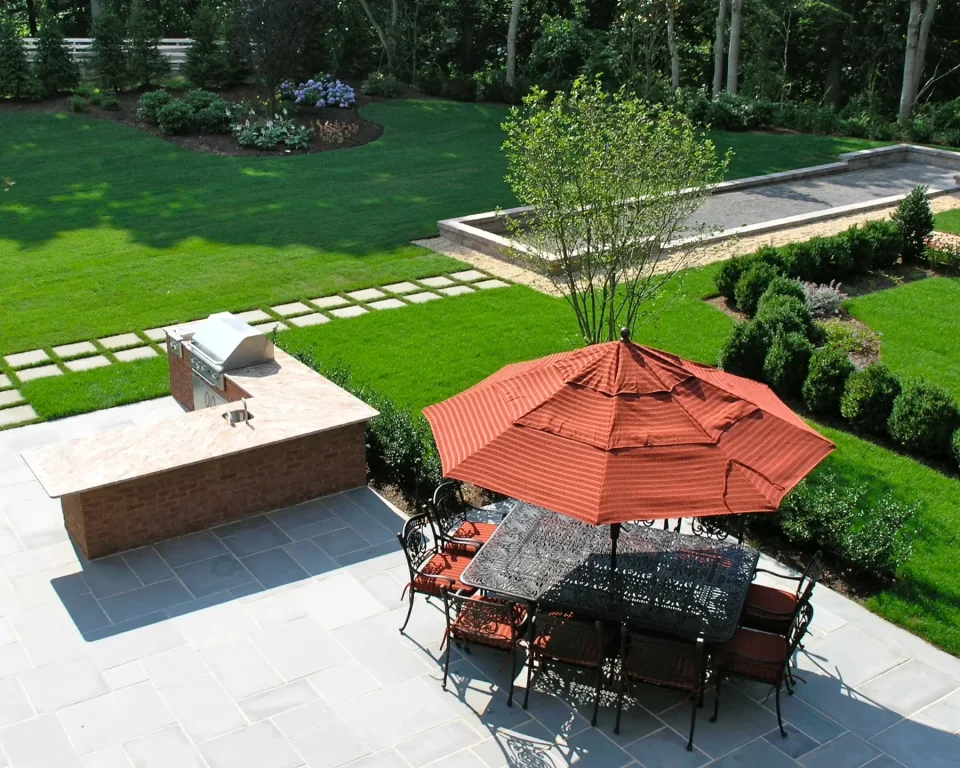 beautifully landscaped backyard with patio furniture